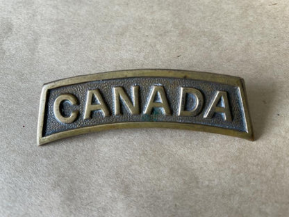 Gradia Militaria -  WW1 British made CANADA other ranks shoulder title.