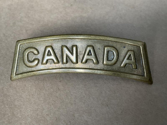 Gradia Militaria -  WW1 CANADA brass title stamped CARON BROS MONTREAL 1916.