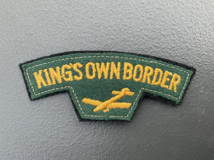 Gradia Militaria -  KINGS OWN BORDER cloth shoulder title.
