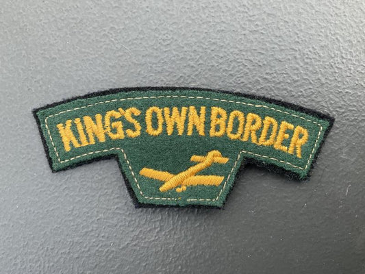 Gradia Militaria -  KINGS OWN BORDER cloth shoulder title.