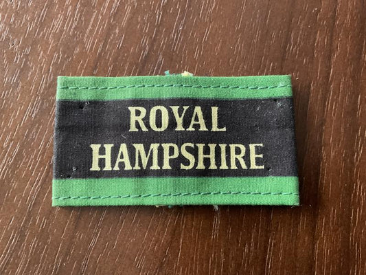Gradia Militaria -  ROYAL HAMPSHIRE Regt Malaya era printed cloth slip on title.