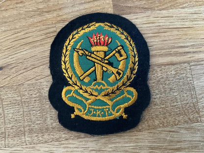 Gradia Militaria -  Tanzania J.K.T (National Army) Officers hat badge.