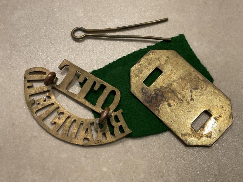 BRADFIELD COLLEGE O.T.C brass shoulder title.