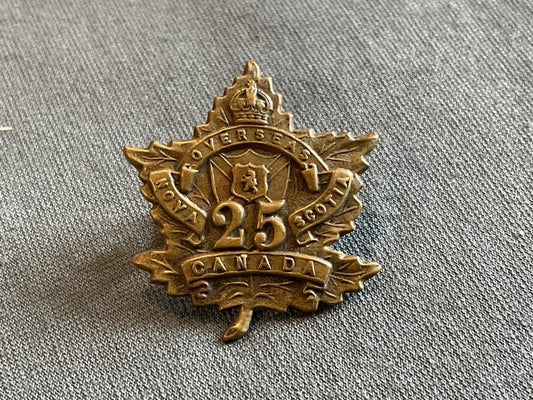 Gradia Militaria -  WW1 C.E.F 25th Infantry Battalion collar badge by Gaunt.