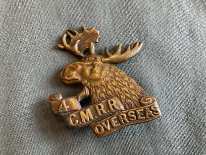 Gradia Militaria -  WW1 C.E.F 4th Canadian Mounted Rifle Battalion cap badge.
