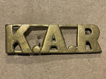 Gradia Militaria -  K.A.R (Kings African Rifles) brass shoulder title.