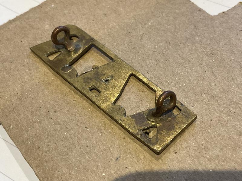 K.A.R (Kings African Rifles) brass shoulder title.