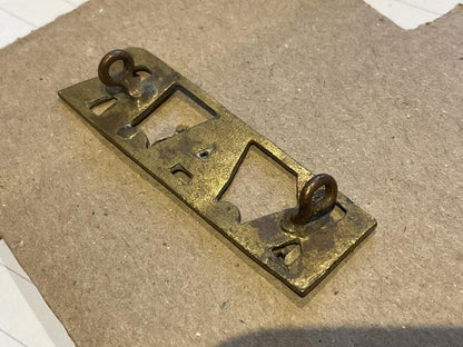 K.A.R (Kings African Rifles) brass shoulder title.