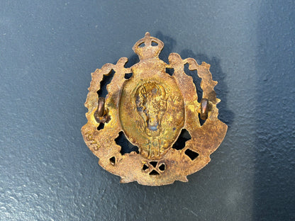 1973 issue N.W.M.P gilt & enamel commemorative cap badge