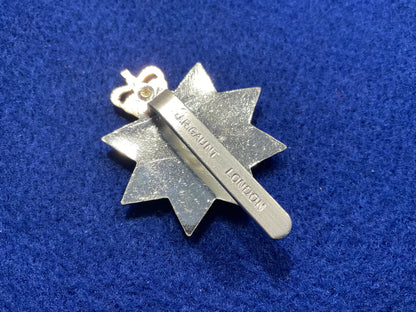 Anodised Queens Royal Surrey Regt cap badge by Gaunt