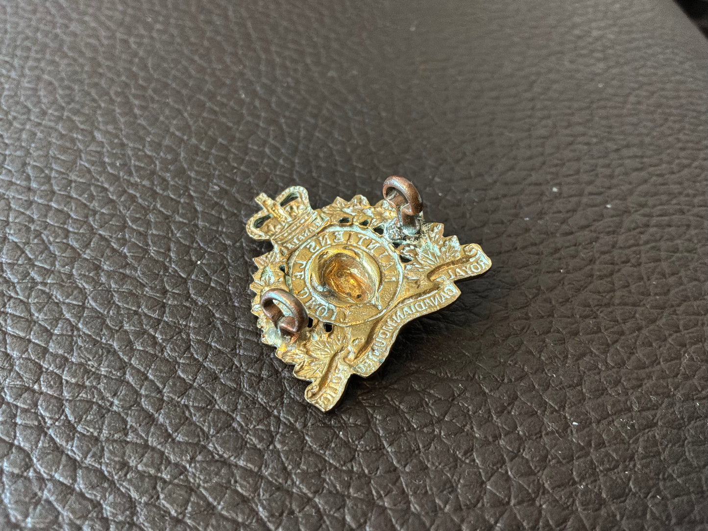 Q/C Royal Canadian Mounted Police brass collar badge.