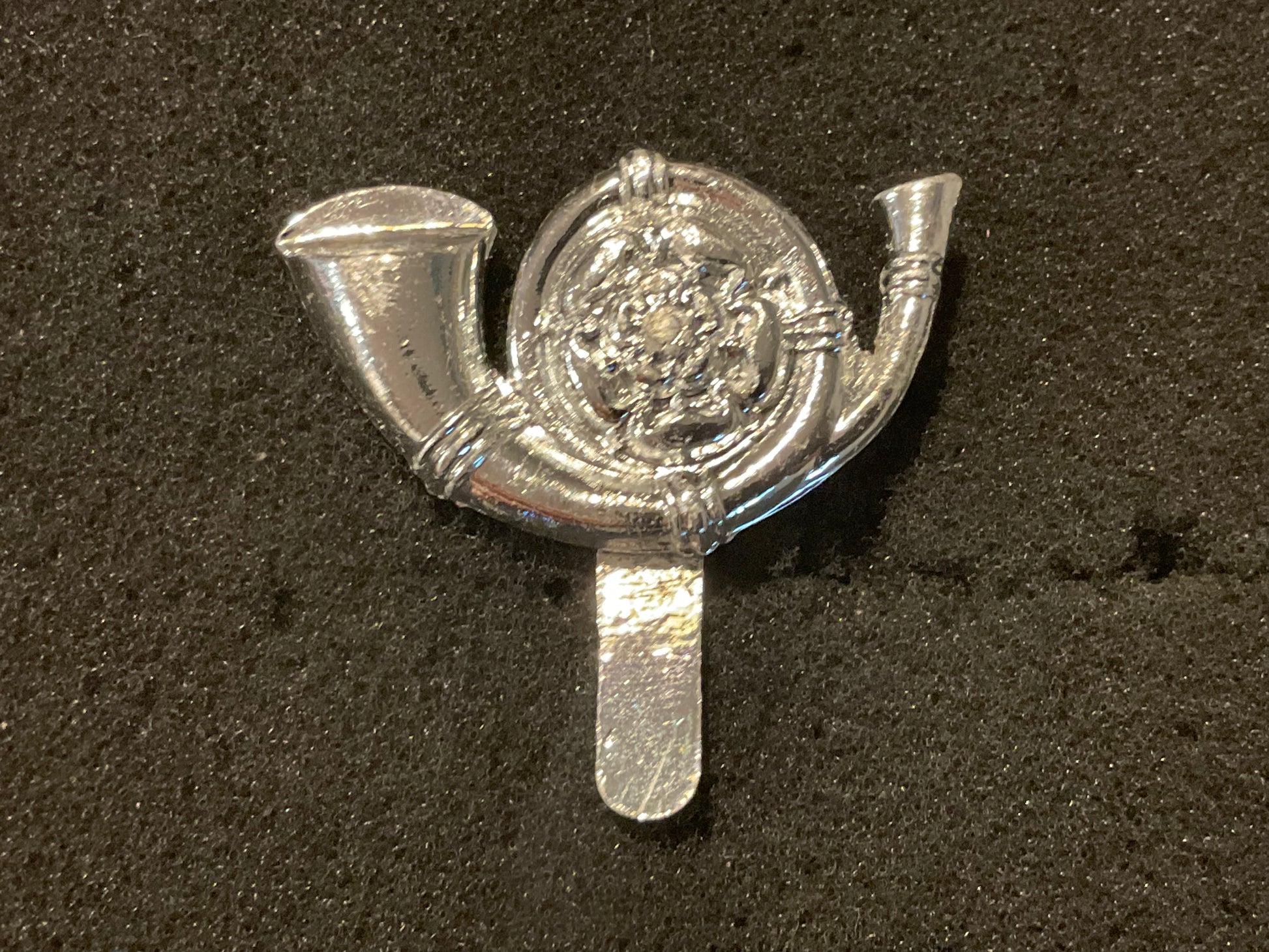 The Kings Own Yorkshire Light Infantry anodised cap badge.