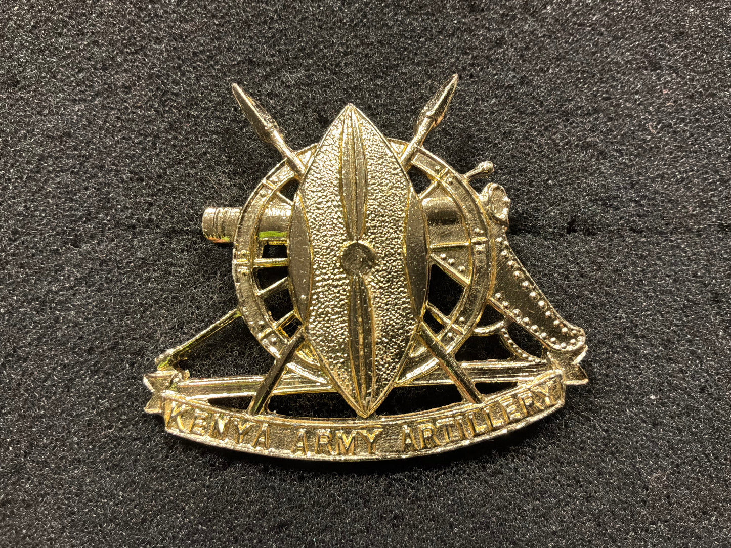 Anodised Kenya Army Artillery cap badge.