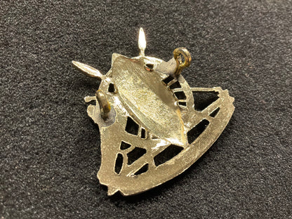 Anodised Kenya Army Artillery cap badge.