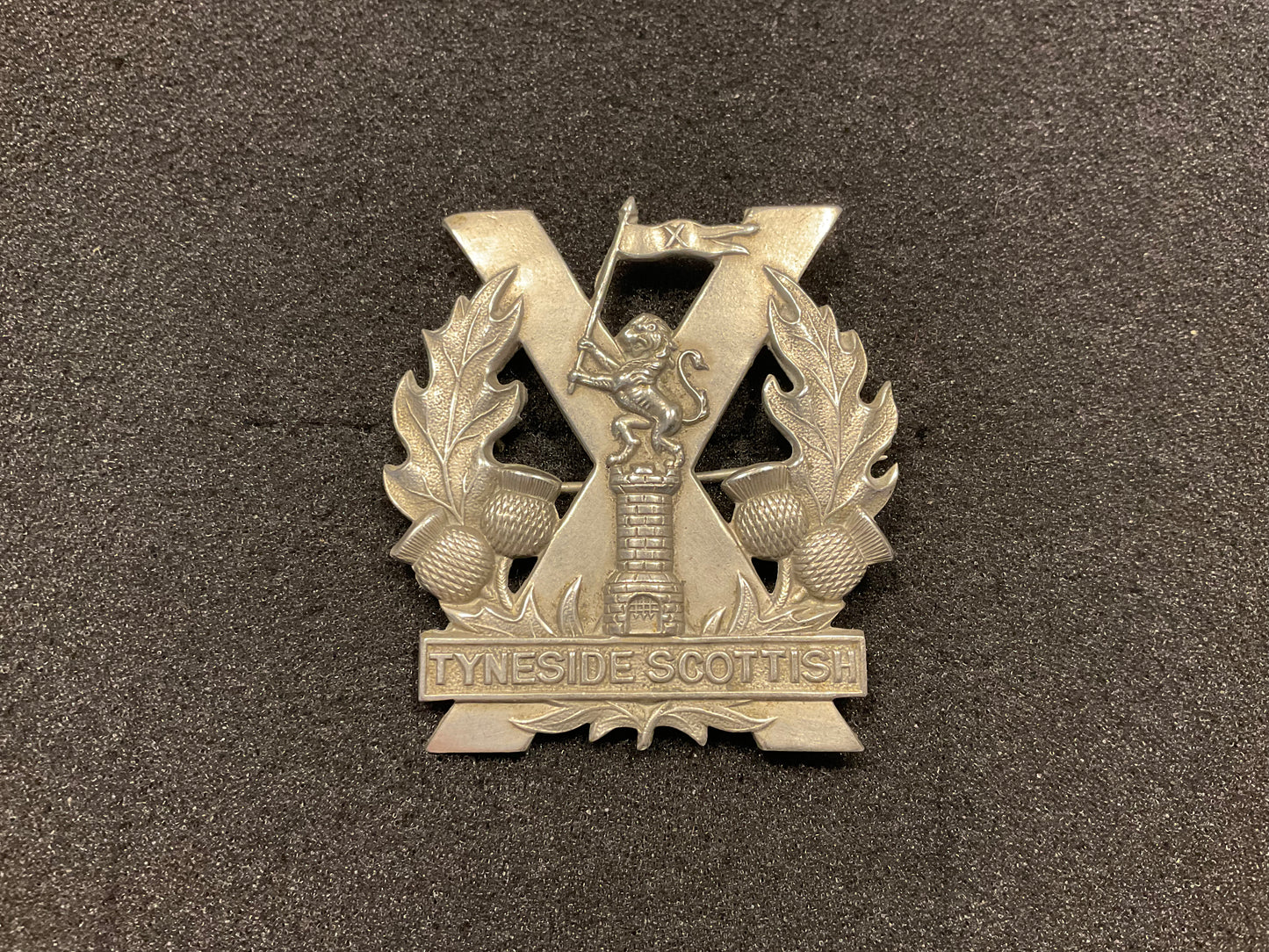 Tyneside Scottish Glengarry with full lion above tower.