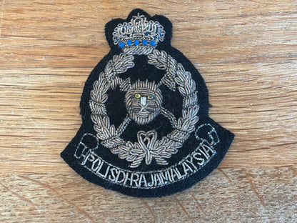 Malaysian Police bullion cap badge.