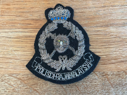 Malaysian Police bullion cap badge.