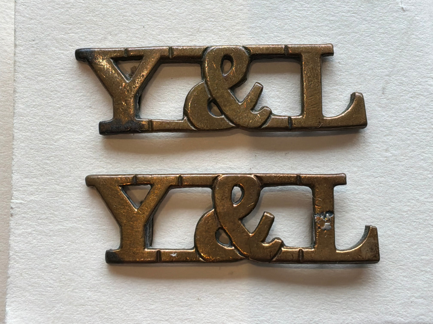 WW1 York & Lancaster Regiment ORs brass shoulder titles.