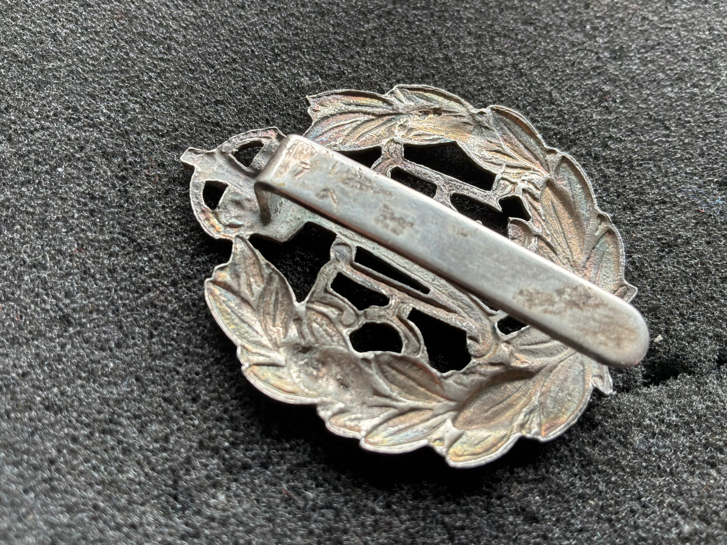 Post 1918 RAF band or police white metal cap badge with rear slider.