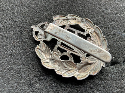 Post 1918 RAF band or police white metal cap badge with rear slider.