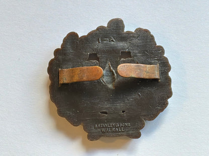 WW2 Essex Regiment plastic economy cap badge.