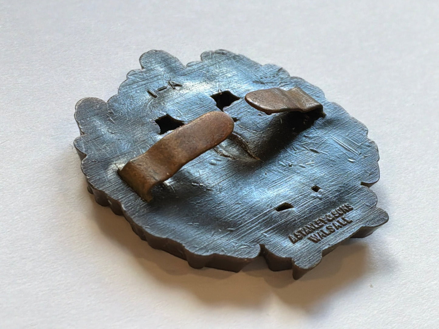 WW2 Essex Regiment plastic economy cap badge.