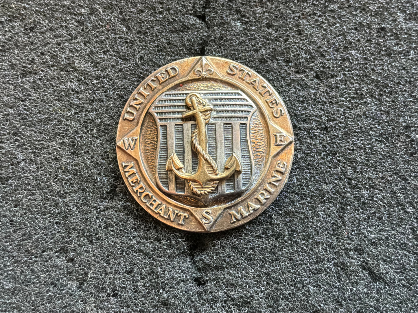 WWII-era United States Merchant Marine service lapel badge in sterling.