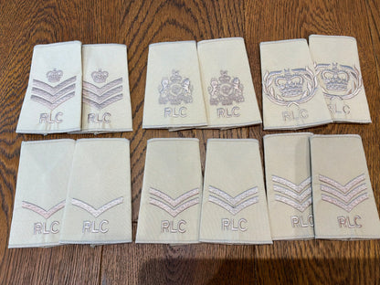 Royal Logistic Corps (RLC) rank slides in desert/tropical tan, subdued embroidery. 6 different rank pairs.
