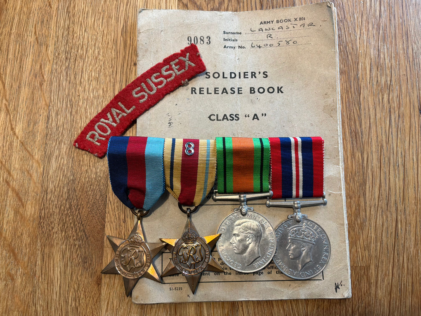 WW2 Royal Sussex Regt, P.O.W from Crete, Stalag 383 release book & medals