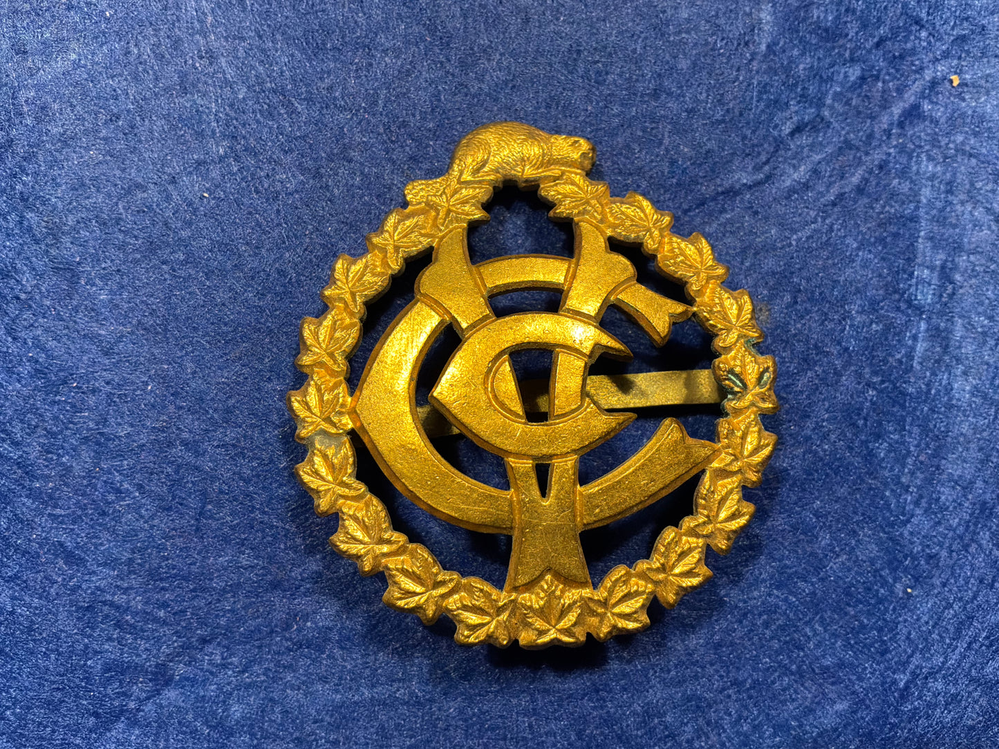 WW1 CEF Canadian Army Veterinary Corps cap badge by Scully.