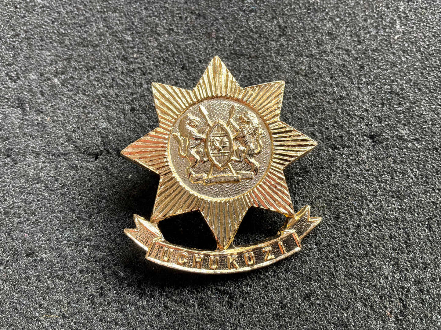 Kenyan Army Transport/ Logistics corps anodised cap badge.