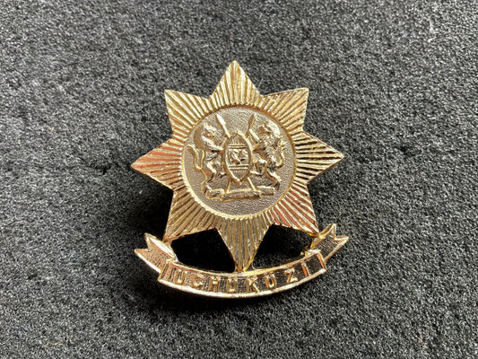 Kenyan Army Transport/ Logistics corps anodised cap badge.