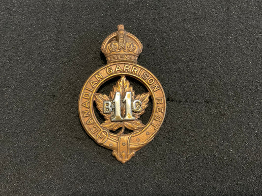 WW1 C.E.F 11th Battalion Garrison Regiment Officers cap badge.
