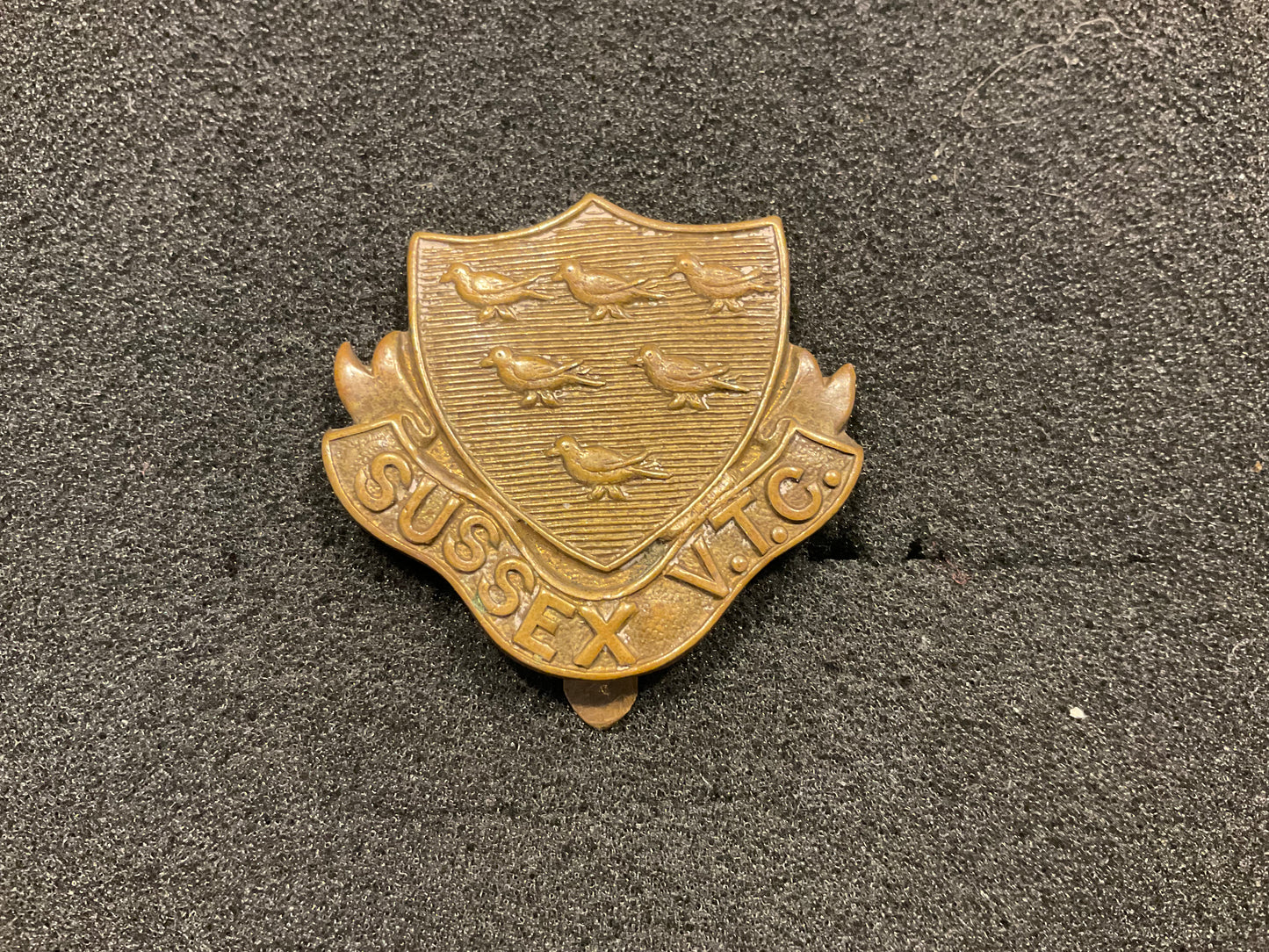 WW1 Sussex V.T.C Brass cap badge.