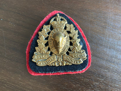 K/C brass Royal Canadian Mounted Police (RCMP) cap badge.