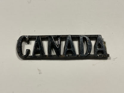 WW1 CEF small blackened brass ‘CANADA’ shoulder title