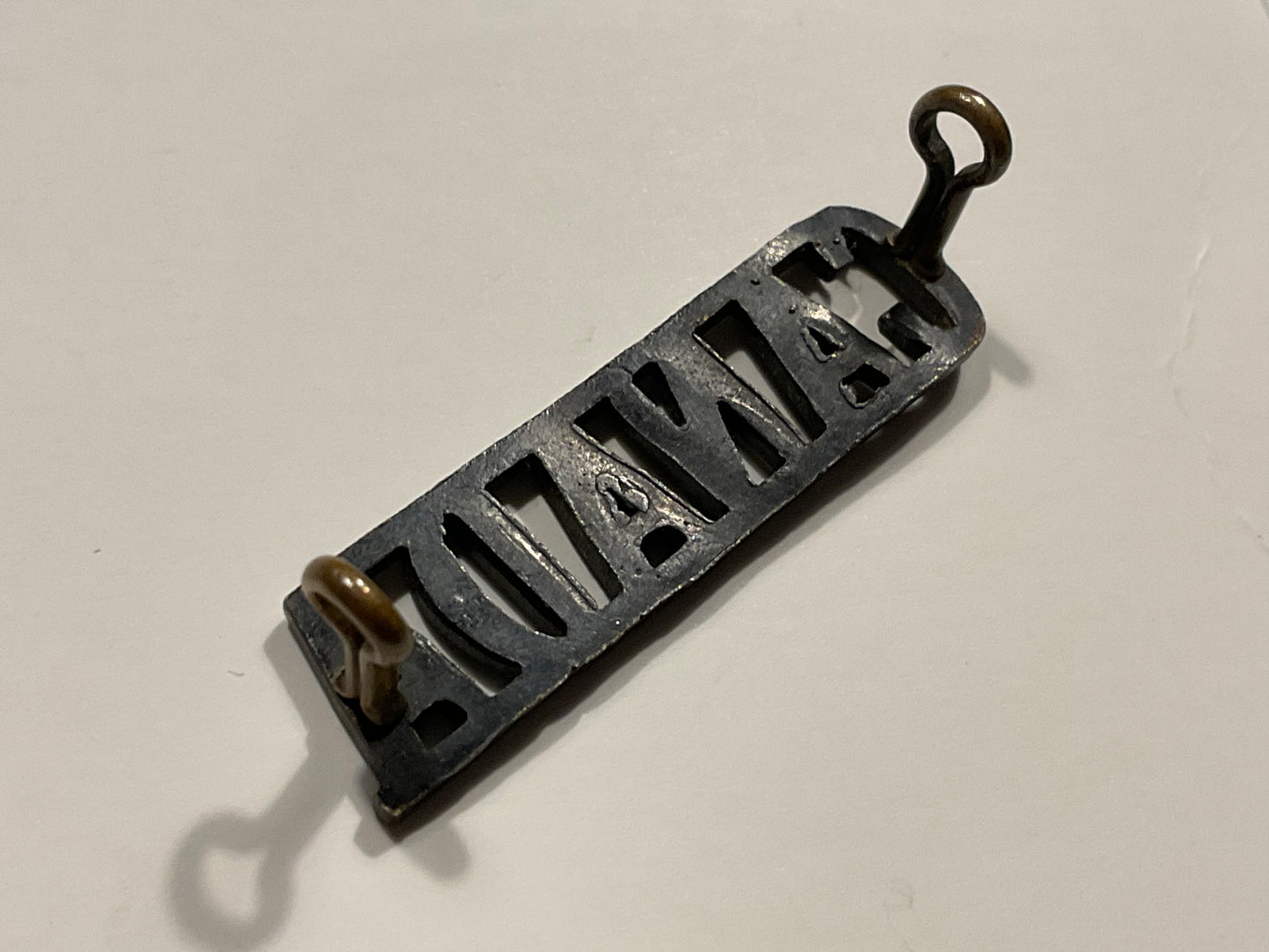 WW1 CEF small blackened brass ‘CANADA’ shoulder title