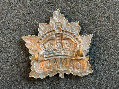 WW1 CEF 1914 dated General Service cap badge made by P.W ELLIS & CO