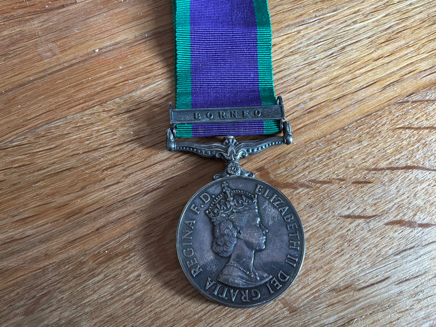 G.S.M with BORNEO bar, correctly marked on rim 23673895 GNR. B.G.C BAKER R.A