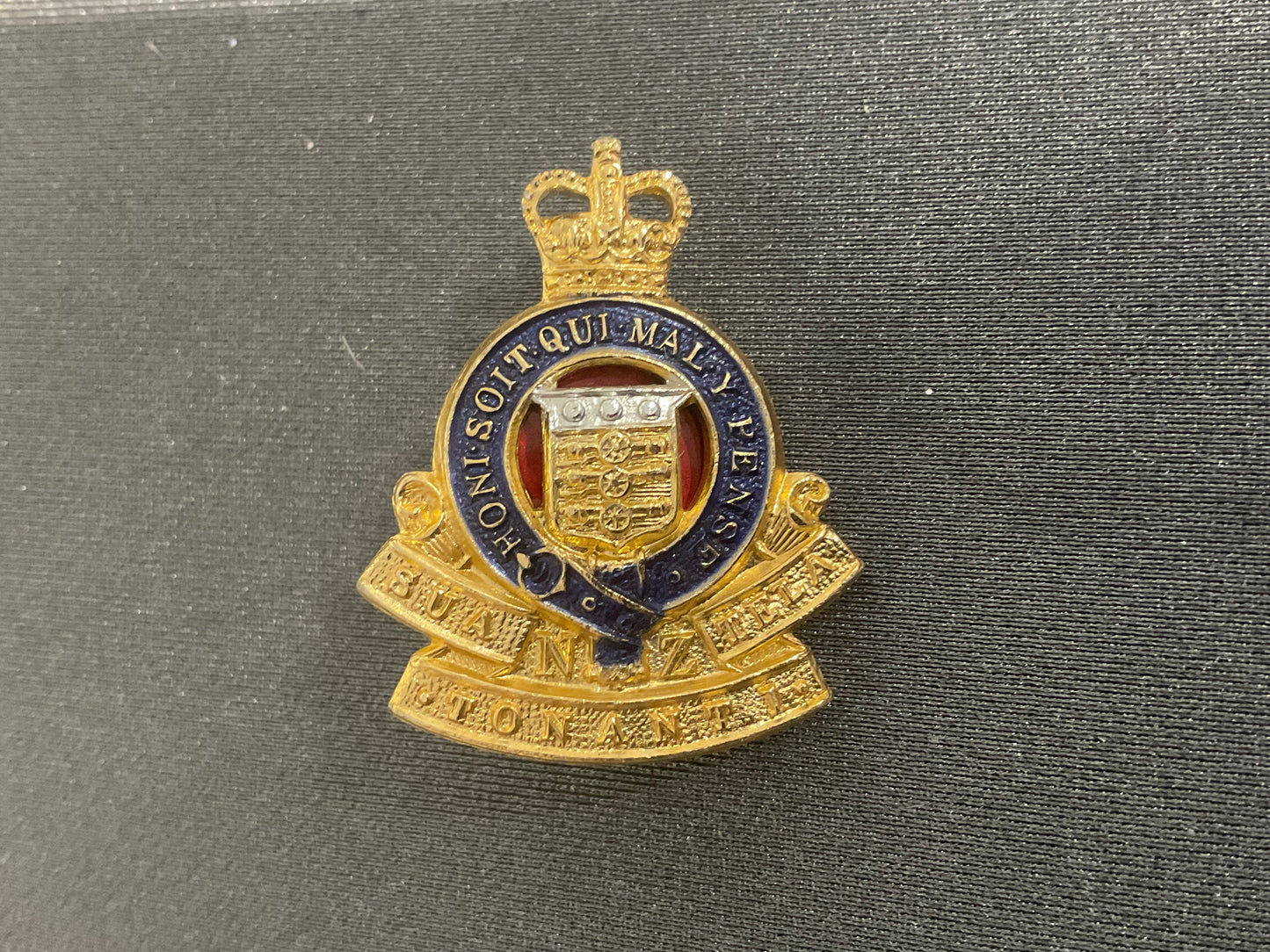 Anodised NZ Ordnance corps collar badge.
