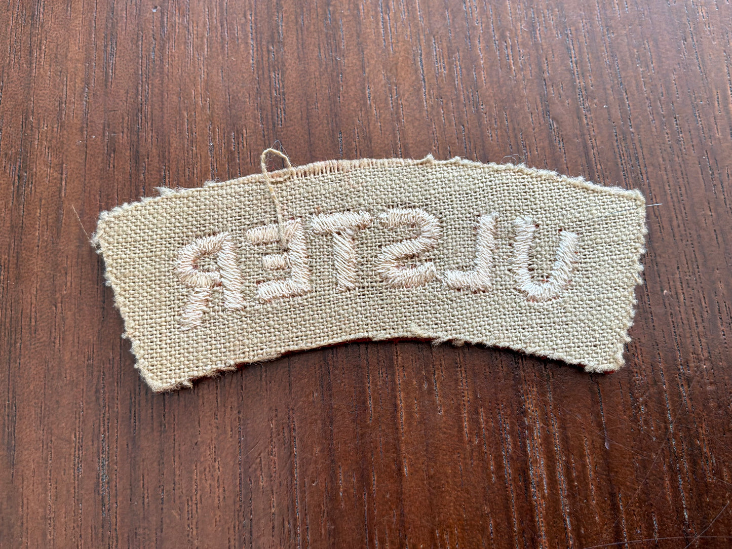 Rare WRAC ‘ULSTER’ terracotta brown wool shoulder title.