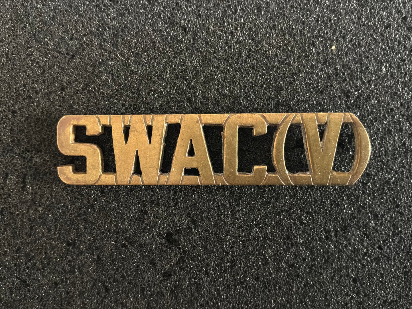 SWAC(V) — Singapore Women’s Auxiliary Corps (Volunteers) title

The Women’s Auxiliary Corps was formed as a support arm of the Singapore Volunteer Corps in the 1950s, alongside other new units like the Singapore Royal Artillery and Singapore Armoured
