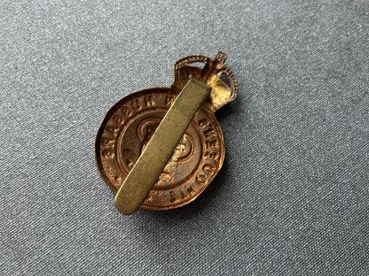 WW1 Economy brass 7th Queens Own Hussars cap badge.