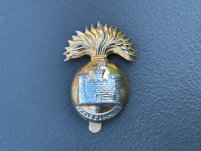 Anodised The Royal Inniskilling Fusiliers cap badge by Firmin.
