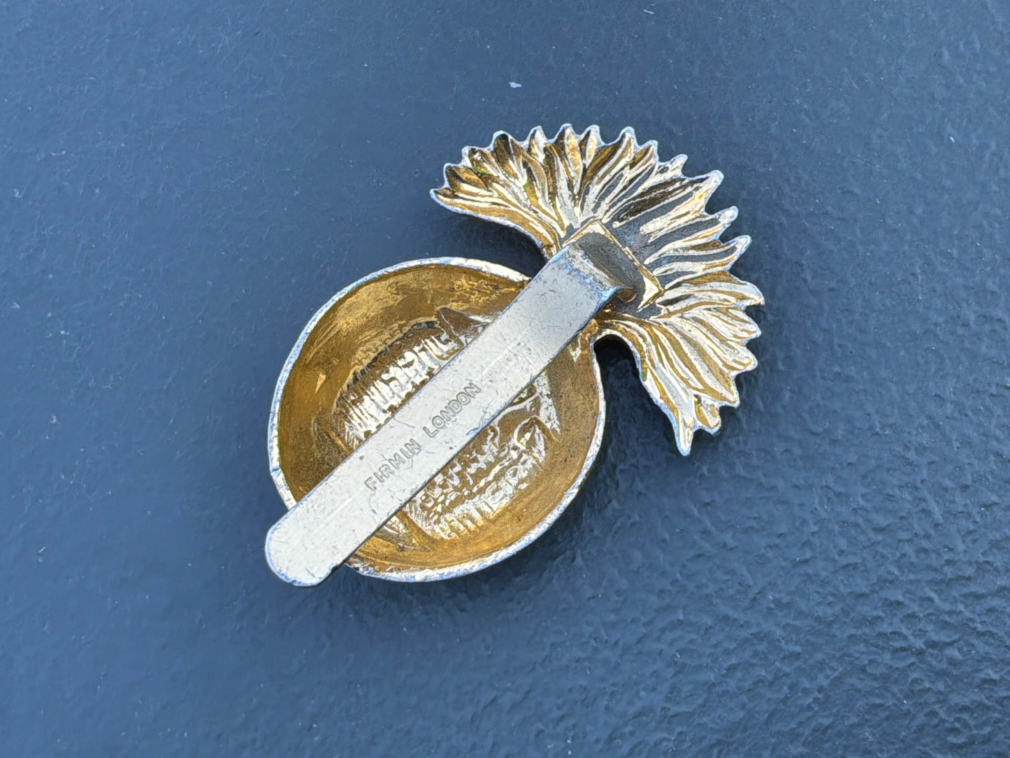 Anodised The Royal Inniskilling Fusiliers cap badge by Firmin.
