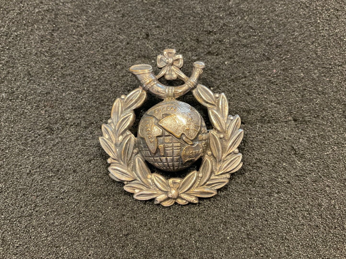 WW1 R.M.L.I Silver plated broached cap badge