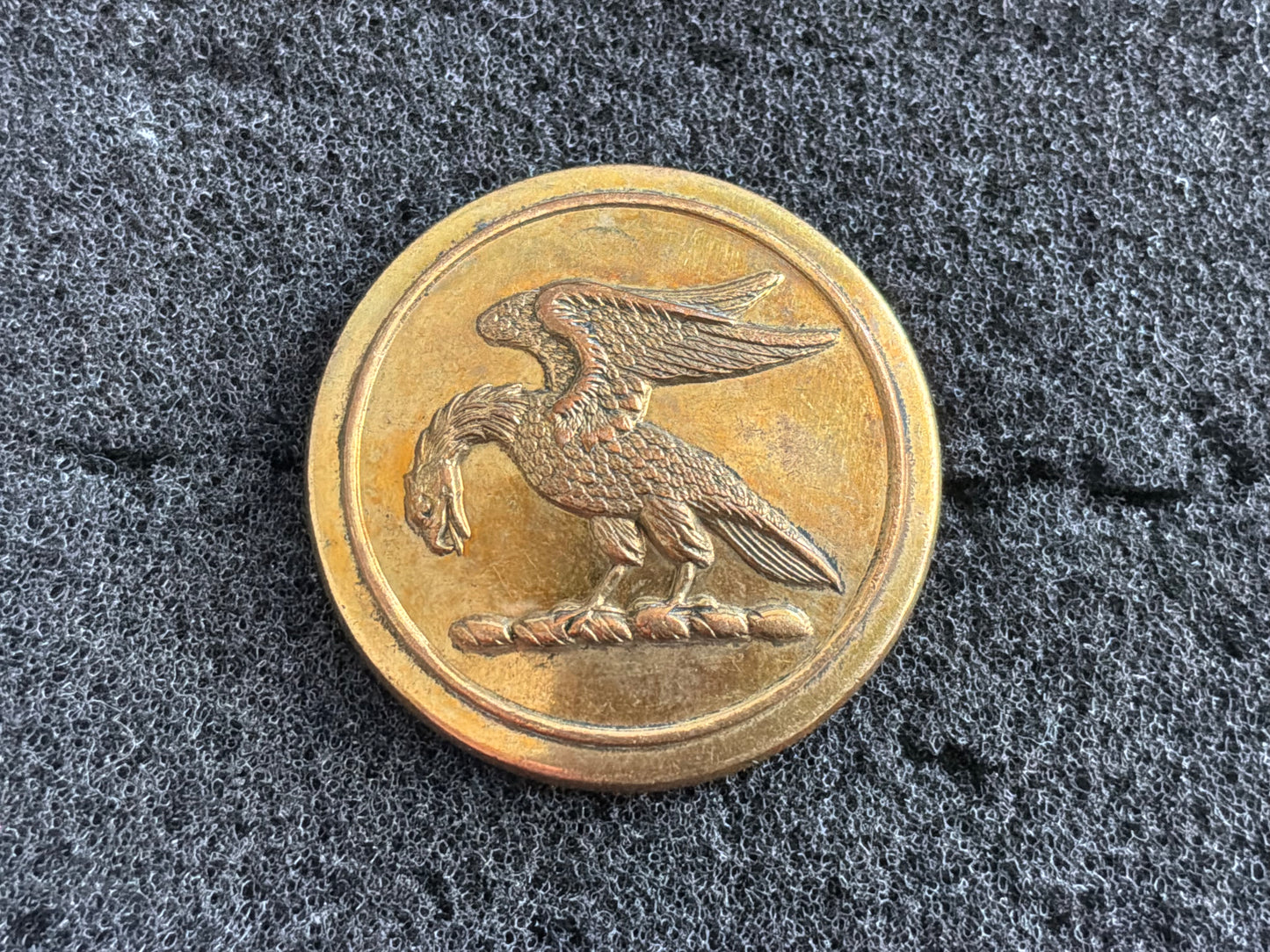 Early Mythical bird hunt/livery button by rare maker.