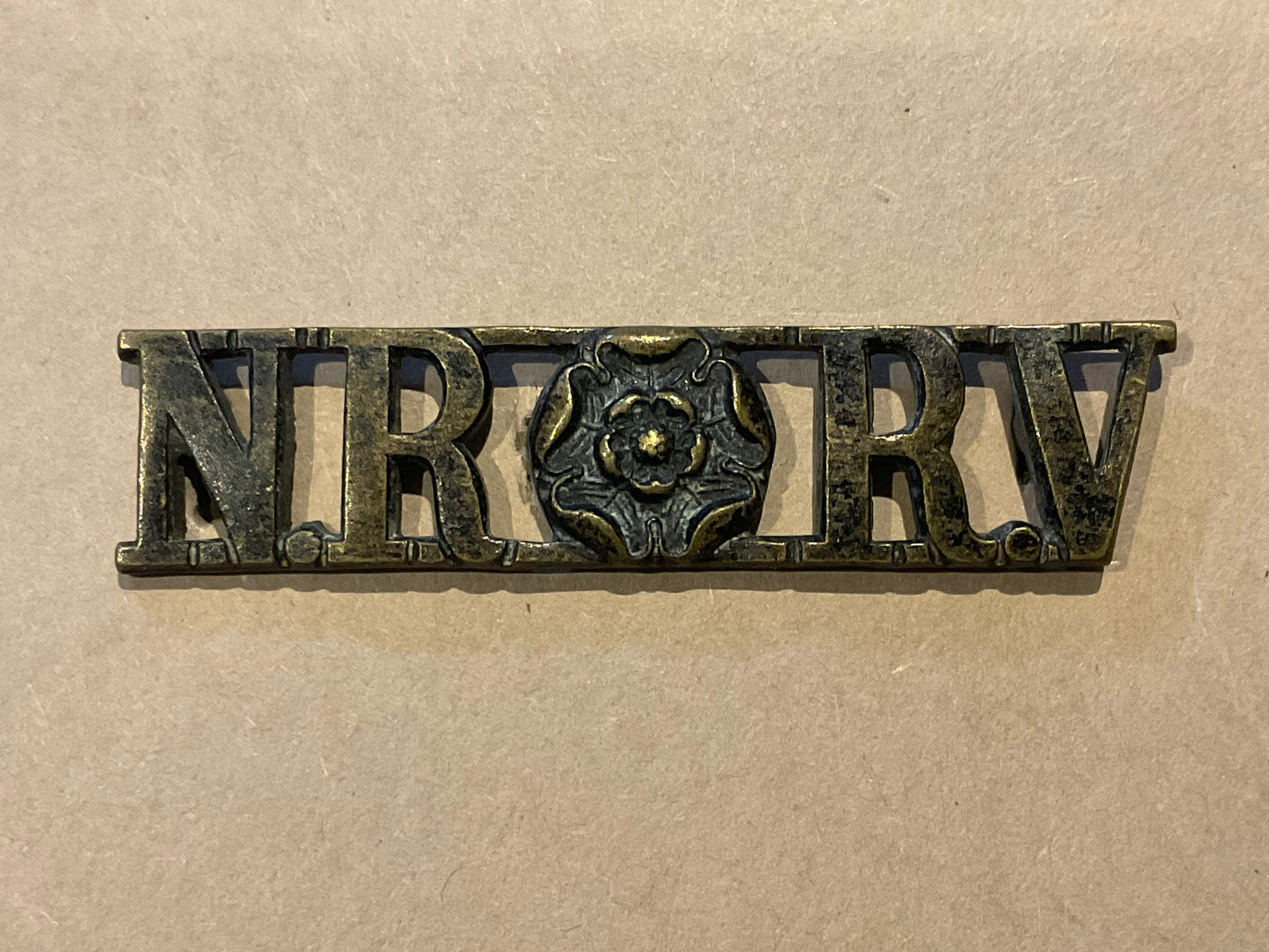 Shoulder title for the North Riding Rifle Volunteers (NR RV).