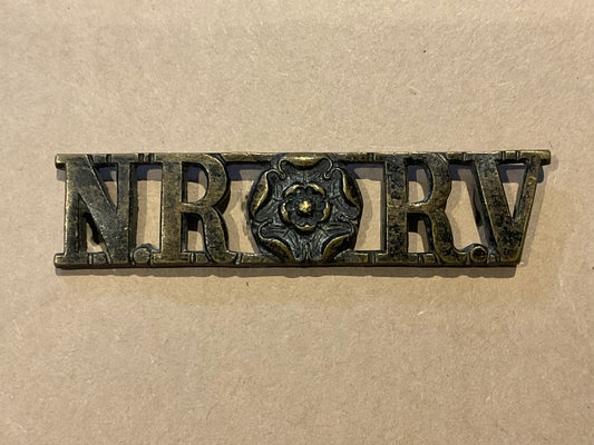 Shoulder title for the North Riding Rifle Volunteers (NR RV).