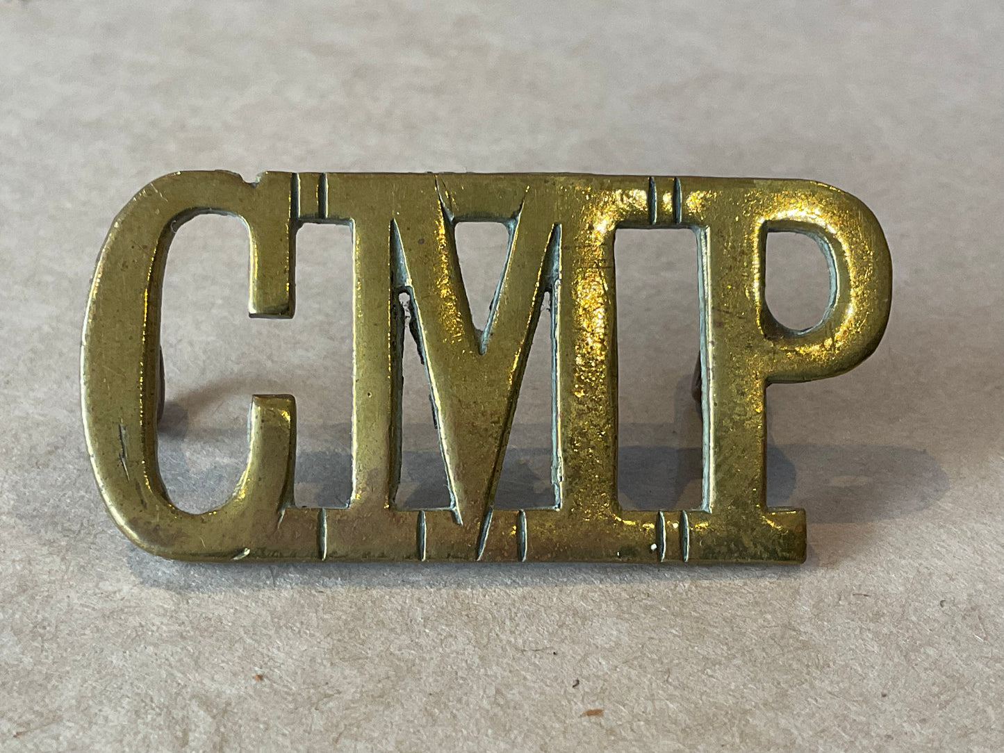 WW1/2 C.M.P (Corps of Military Police) brass shoulder title.